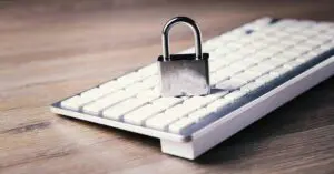 a computer keyboard with a padlock on top of it